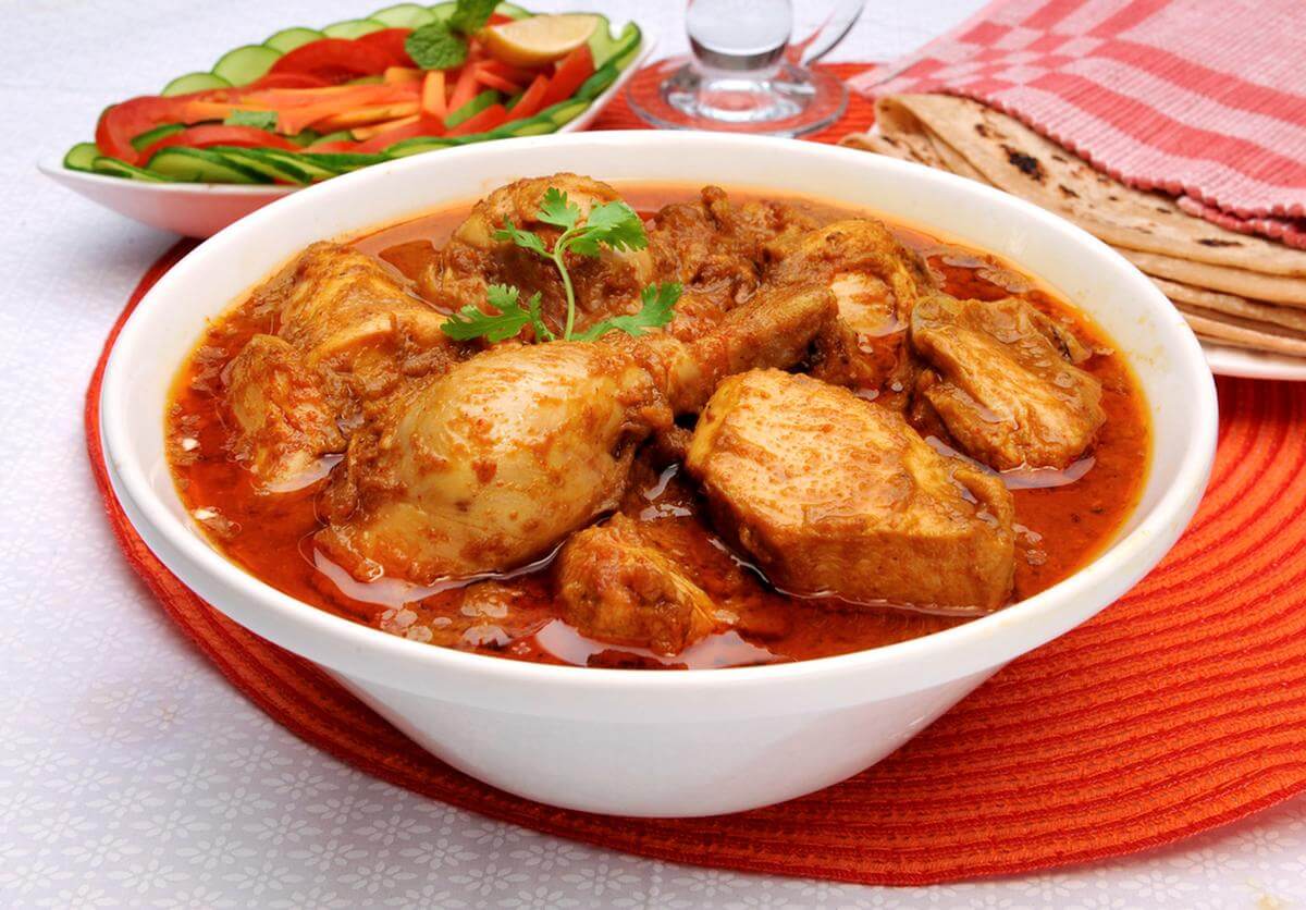 chicken curry in a big white bowl