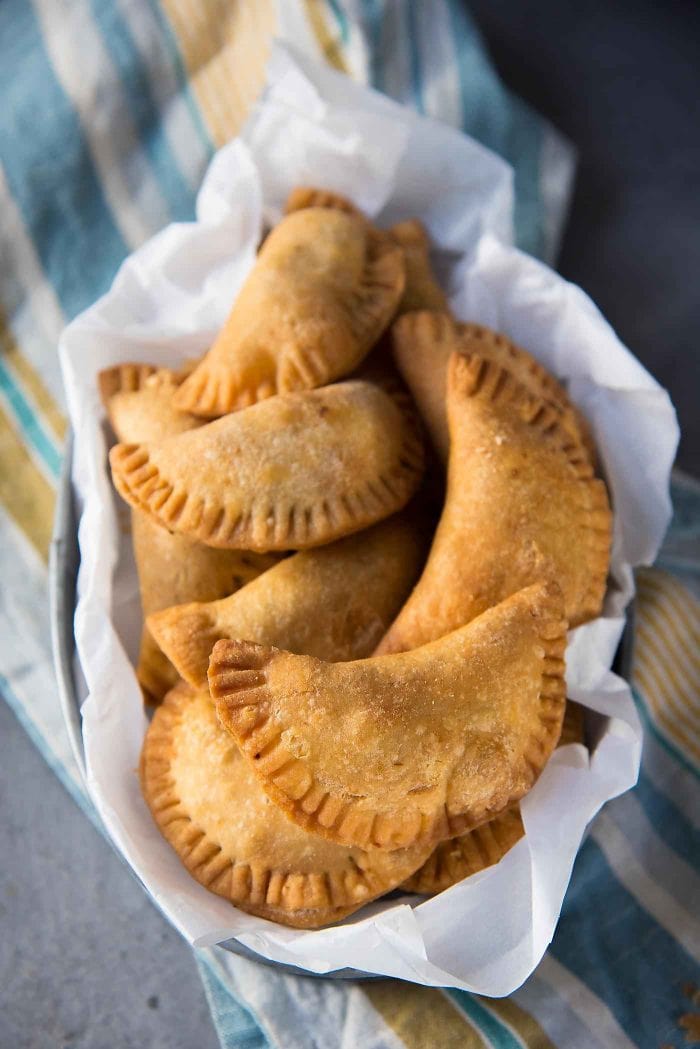 Sri Lankan Fish Patties - These fish empanadas are epic! A spicy fish filling inside perfectly flaky buttery crust. Perfect for snacking. Step by step instructions to make these Sri Lankan Patties. Freezer friendly too. 